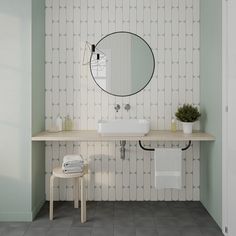 a bathroom with a sink, mirror and stool next to a wall mounted faucet