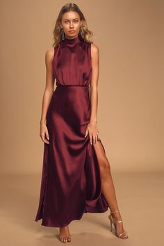 Feel like the Queen that you are in the Lulus Classic Elegance Wine Satin Sleeveless Mock Neck Maxi Dress! Luxe woven satin shapes this gorgeous dress that has a mock neckline and a sleeveless bodice with gathered fabric detailing. An elasticized waist tops a stunning maxi skirt complete with twin side slits. Keyhole opening and double button closure at back. Hidden back zipper/clasp. Dana Berez, Vestidos Color Vino, Wine Maxi Dress, Mock Neck Maxi Dress, Formal Wedding Guests, Sleeveless Mock Neck, Fall Wedding Guest Dress, Guest Attire, Mock Neck Dress