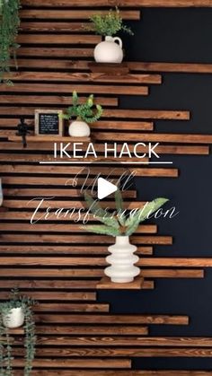 there is a wooden wall with vases and plants on it in front of the words ikea hack