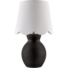 a black table lamp with a white shade on the base and a light bulb attached to it