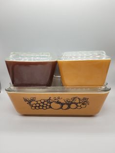 two containers with food in them sitting on a table