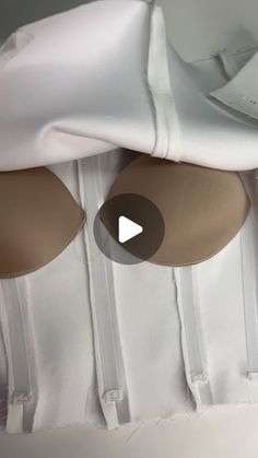 a video demonstrating how to tie the back of a wedding dress with satin bow ties