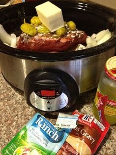 an image of food in the crock pot on the kitchen counter with it's ingredients