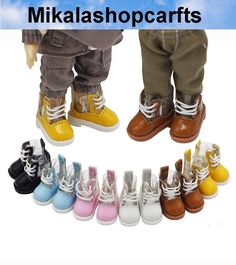 several pairs of baby shoes with different colors and sizes on the bottom one is yellow, the other is blue