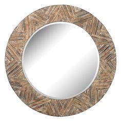 a round mirror that is made out of wood and has an intricate pattern on it