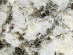 a close up view of marble with brown and white speckles on the surface