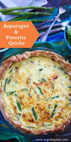 asparagus and pancetta quiche in a blue pie dish on a table