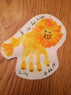 a paper cut out of a lion with writing on it