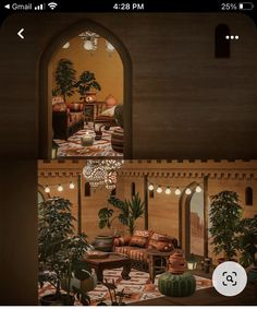 a living room filled with furniture and potted plants