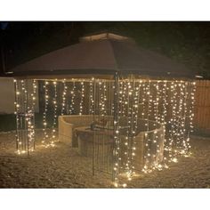 an outdoor gazebo with lights on it