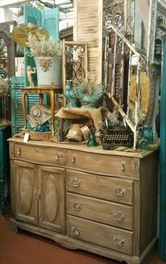 an antique dresser with many items on it