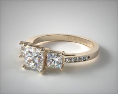 three stone diamond engagement ring with channel set diamonds on the sides, in 18k white gold