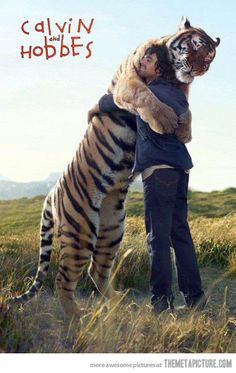 a man hugging a large tiger on top of a grass covered field with the caption oh tiger, oh food