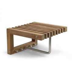 a wooden bench with metal brackets on it