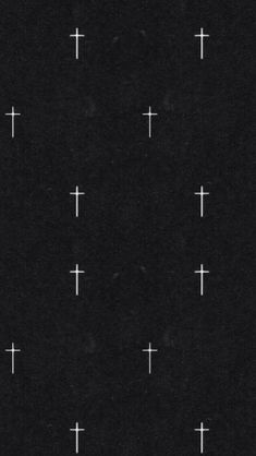 a black background with white crosses on it