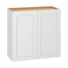 a white cabinet with two doors and a wooden top