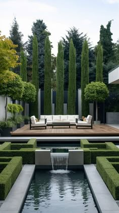 an outdoor living area with water feature and seating