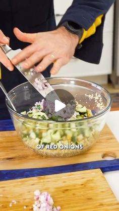 a person cutting up vegetables in a bowl