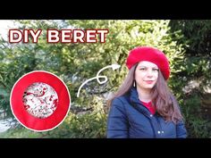 a woman wearing a red hat and jacket with the words diy beret on it