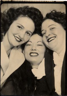 three women are posing for the camera with their mouths open