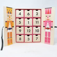 an open card with numbers and figures in the shape of nutcrackers on it