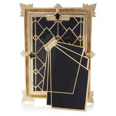 an art deco frame with black and gold geometric designs on the front, along with two matching frames