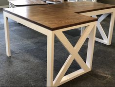 a wooden table sitting on top of a carpeted floor