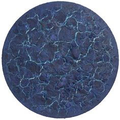 a round blue plate with cracks in it