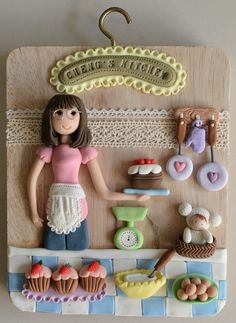 a doll is standing in front of a counter with cupcakes and pastries