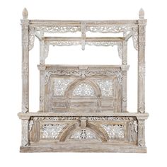 an old wooden bed with intricate carvings on the headboard and foot board, isolated against a white background