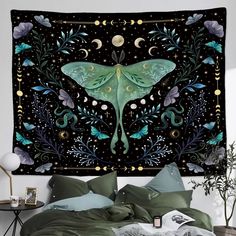 a large tapestry hanging on the wall above a bed