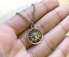 The sun, our beloved sun of the solar system, provider of all life! This necklace is ideal for anyone who loves the sun, anyone who is a fire element or is a Leo sun. Product Type, materials, and other details: 16” or 18” Stainless Steel Necklace with Stainless Steel lobster clasp. Sun charm in Antiqued Silver with zinc alloy materials about 1/2” in size. Product Type: Stainless steel necklaceHandcrafted in CT, USA. Free shipping in US within 2-5 business days. Gift Packaging included. window.da Sterling Silver Sun Necklace, Adjustable Metal Necklace With Sun And Moon Design, Adjustable Sun And Moon Metal Necklace, Adjustable Sun And Moon Necklace, Adjustable Metal Necklace With Sun Design, Adjustable Sun And Moon Design Metal Necklace, Silver Sun Necklace With Sun And Moon Design, Silver Necklace With Sun And Moon Design, Adjustable Sun Design Jewelry