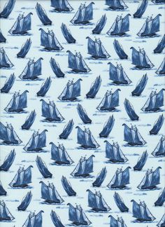 a blue and white sailboat pattern is shown