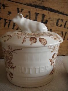 a ceramic container with a white bear on it