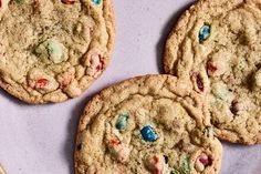 three cookies with m & m's on them