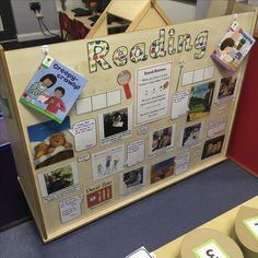 a bulletin board with pictures and magnets on it that says reading in the classroom