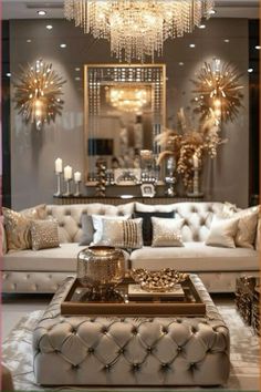 a living room filled with lots of furniture and chandelier hanging from the ceiling