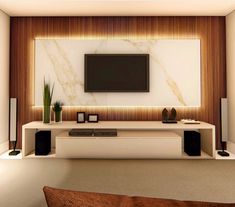 a living room with a television and speakers