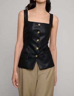 Chic black vegan leather square neckline vest top with decorative gold button front. Brand Pixie Market 100% faux leather Fits true to sizePlease take your usual sizeSize XS bust 32" waist 26" length 23"Size S bust 34" waist 28" length 23"Size M bust 36",waist 30" length 24"Size L bust 38", waist 32" length 25"Model is wearing a size SmallImported Chic Buttoned Tank Top, Chic Square Neck Top With Buttons, Chic Square Neck Tops With Buttons, Chic Fitted Leather Vest, Fitted Tops With Gold Buttons For Workwear, Chic Square Neck Top With Button Closure, Elegant Fitted Tank Top With Buttons, Chic Fall Tank Top With Button Closure, Leather Fits