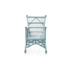 a blue wicker chair sitting on top of a white floor