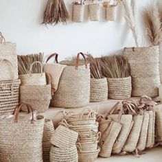 many baskets are lined up against the wall