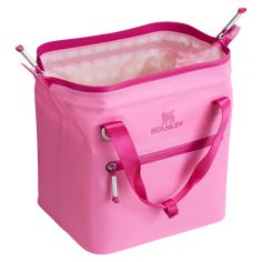 a pink cooler bag with handles and straps