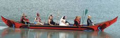 a group of people riding on the back of a boat