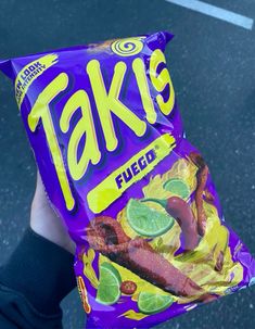 a person holding a bag of fake food