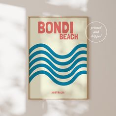 a poster with the words bondi beach printed and shipped in red, white, and blue