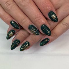 Dark Green Nails with Sun, Moon, and Stars Dark Green Nails Gold Accent, Dark Moon Nails, Dark Green Celestial Nails, Nail Inspo Celestial, Gold And Forest Green Nails, Celestial Nails Acrylic Almond, Emerald Green And Gold Nail Ideas, Blue Gold And Black Nails, Wedding Nails Dark Green