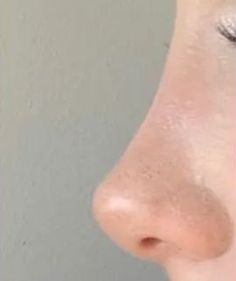 a woman's nose is shown from the side