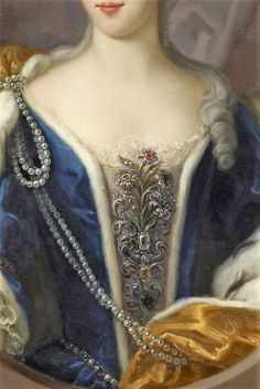 a painting of a woman wearing a blue dress and holding a golden object in her hand