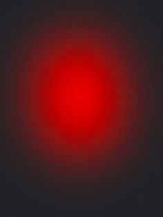 a red circle is shown in the middle of a dark background, with only one light visible