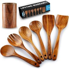 wooden kitchen utensils are lined up next to a canister and spoons